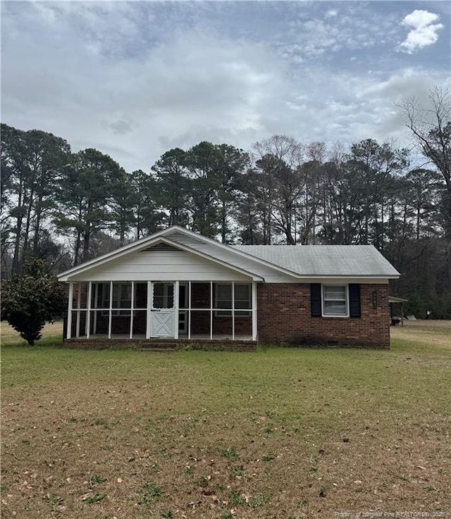 2907 George Owen Rd, Fayetteville, NC 28306 - back of house with a sunroom and a yard