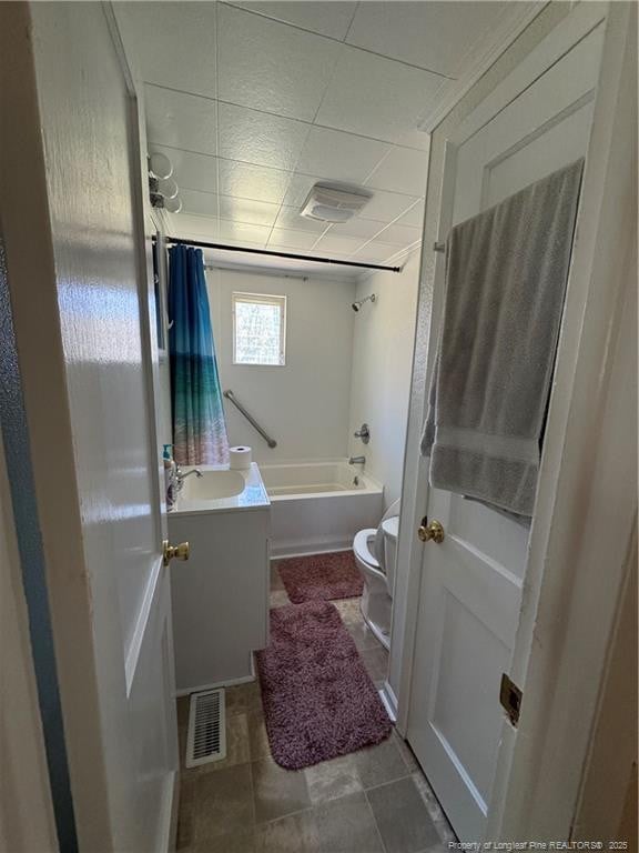 2907 George Owen Rd, Fayetteville, NC 28306 - bathroom with toilet, vanity, shower / bath combo with shower curtain, visible vents, and a drop ceiling