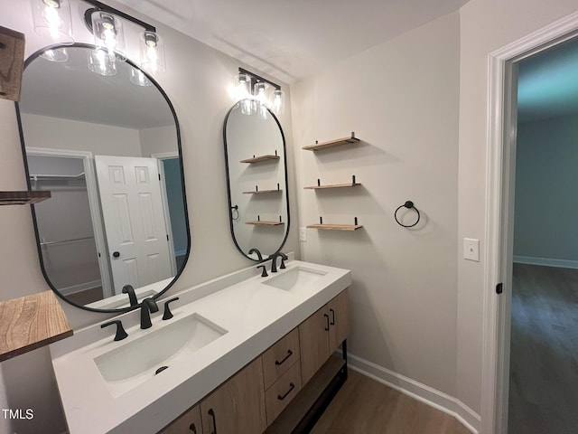 1116 Shadywood Ln, Raleigh, NC 27603 - full bath with wood finished floors, double vanity, and baseboards