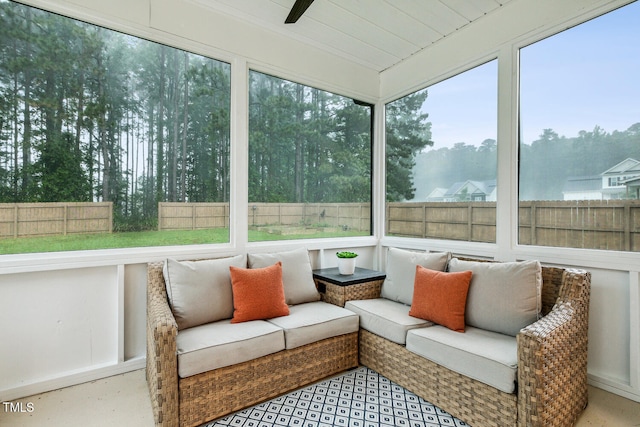 sunroom / solarium with a ceiling fan and an outdoor hangout area