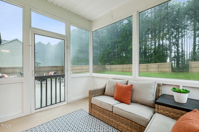 sunroom featuring an outdoor hangout area