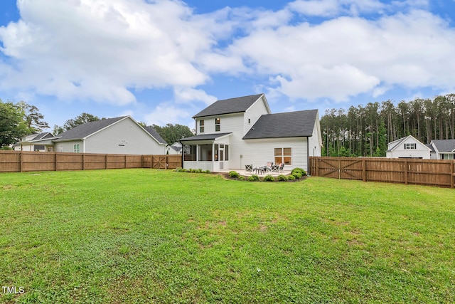 back of property featuring a sunroom, roof with shingles, and a patio