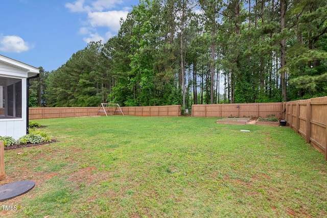 view of yard featuring a sunroom