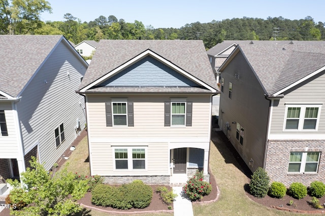 109 Belle Plain Dr, Morrisville, NC 27560 - view of front of house with roof with shingles, stone siding, and a front yard