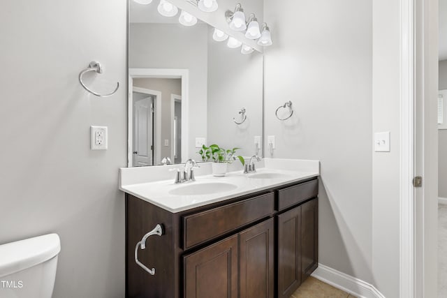 109 Belle Plain Dr, Morrisville, NC 27560 - bathroom featuring toilet, double vanity, and baseboards