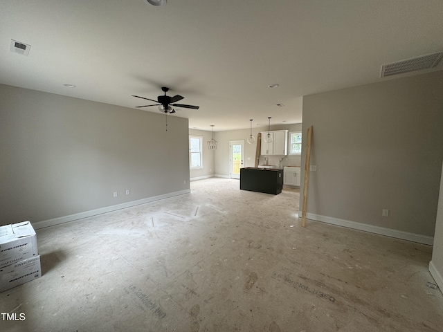9600 Stallings Rd, Spring Hope, NC 27882 - unfurnished living room with ceiling fan and baseboards
