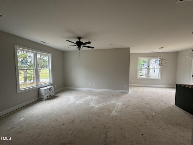 9600 Stallings Rd, Spring Hope, NC 27882 - empty room featuring baseboards, a ceiling fan, and a chandelier