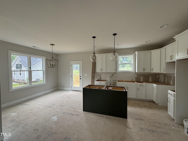 9600 Stallings Rd, Spring Hope, NC 27882 - kitchen with white cabinets, hanging light fixtures, a center island, and recessed lighting