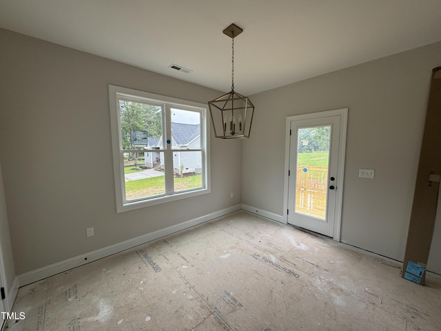 9600 Stallings Rd, Spring Hope, NC 27882 - unfurnished dining area featuring healthy amount of natural light, a chandelier, and baseboards