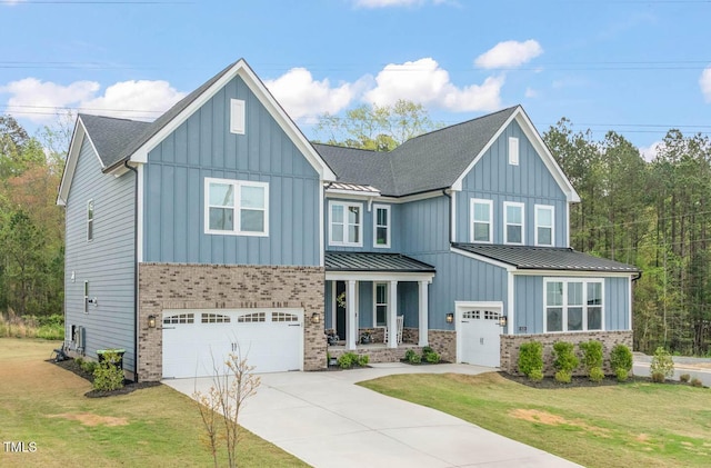 view of front of property featuring concrete driveway, board and batten siding, a standing seam roof, and a garage
