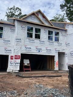 property under construction with an attached garage