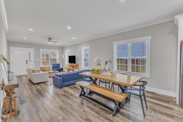 interior space featuring crown molding, ceiling fan, light wood-type flooring, recessed lighting, and baseboards