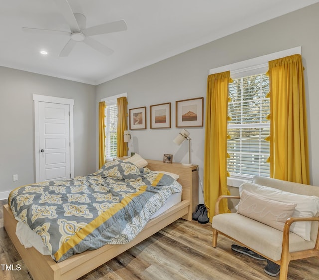 bedroom with recessed lighting, wood finished floors, and a ceiling fan