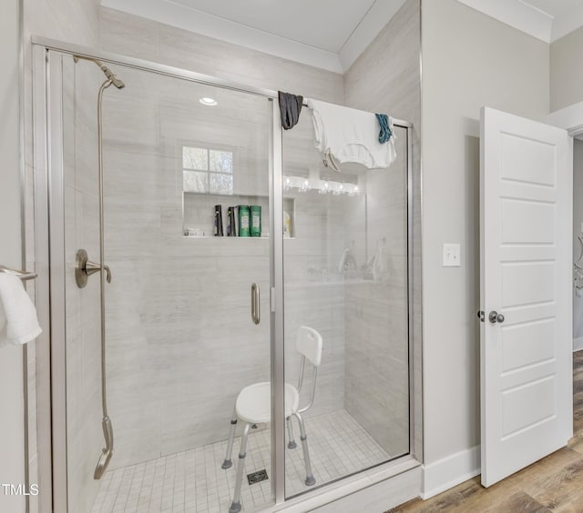 bathroom featuring a stall shower and wood finished floors