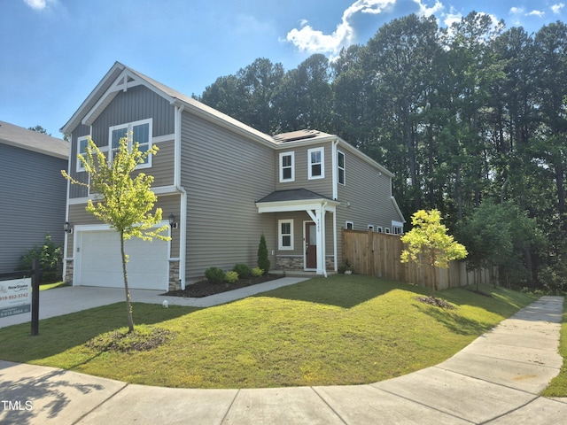4000 Passenger Pl, Durham, NC 27703 - view of front of house with stone siding, concrete driveway, and an attached garage