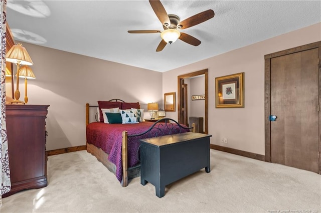 bedroom featuring baseboards, a ceiling fan, and light carpet