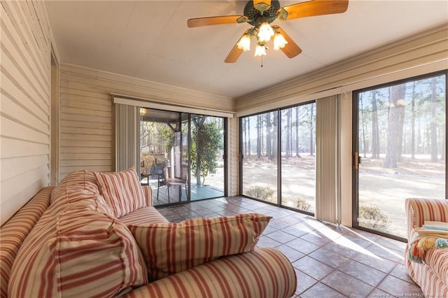 sunroom / solarium with a healthy amount of sunlight and tile patterned flooring