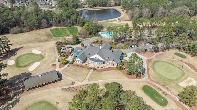 aerial view with a water view and view of golf course
