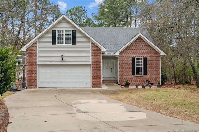 33 Woodbury Ln, Sanford, NC 27332 - view of front of home with an attached garage, brick siding, a front yard, and concrete driveway
