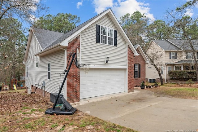 33 Woodbury Ln, Sanford, NC 27332 - view of side of property featuring roof with shingles, driveway, central AC, brick siding, and an attached garage
