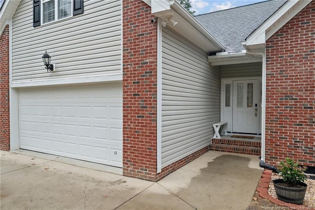 33 Woodbury Ln, Sanford, NC 27332 - entrance to property featuring concrete driveway, brick siding, and a garage