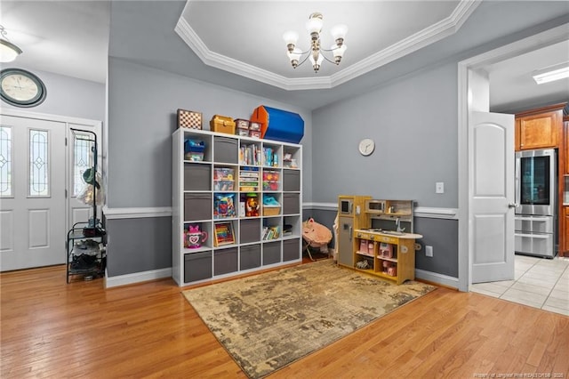 33 Woodbury Ln, Sanford, NC 27332 - game room featuring wood finished floors, baseboards, ornamental molding, and an inviting chandelier