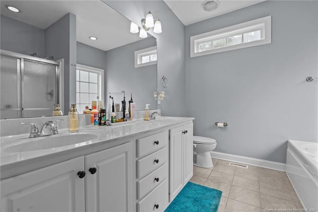 33 Woodbury Ln, Sanford, NC 27332 - bathroom featuring a sink, a shower with shower door, double vanity, baseboards, and visible vents