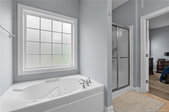 33 Woodbury Ln, Sanford, NC 27332 - full bathroom with baseboards, a stall shower, and a tub with jets