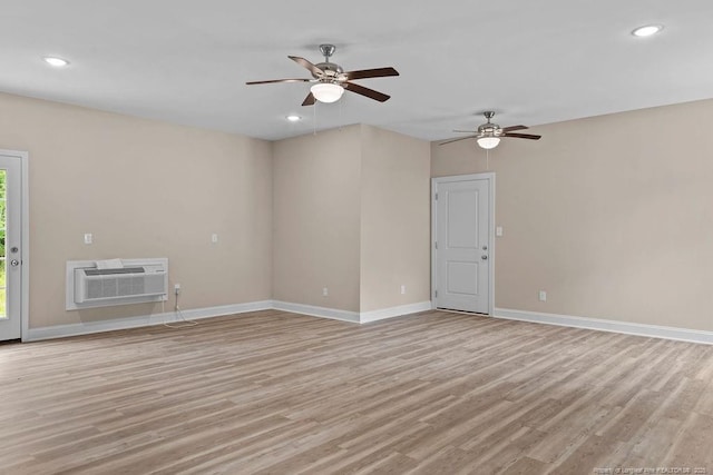 432 Timberline Dr, Fayetteville, NC 28311 - unfurnished living room featuring a wall mounted air conditioner, light wood finished floors, ceiling fan, baseboards, and recessed lighting