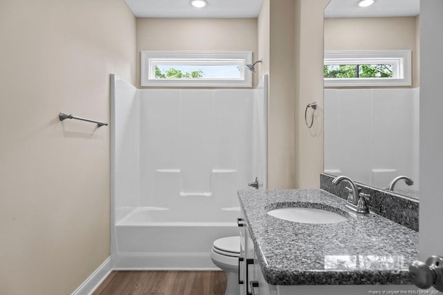 432 Timberline Dr, Fayetteville, NC 28311 - bathroom with healthy amount of natural light, wood finished floors, toilet, and vanity