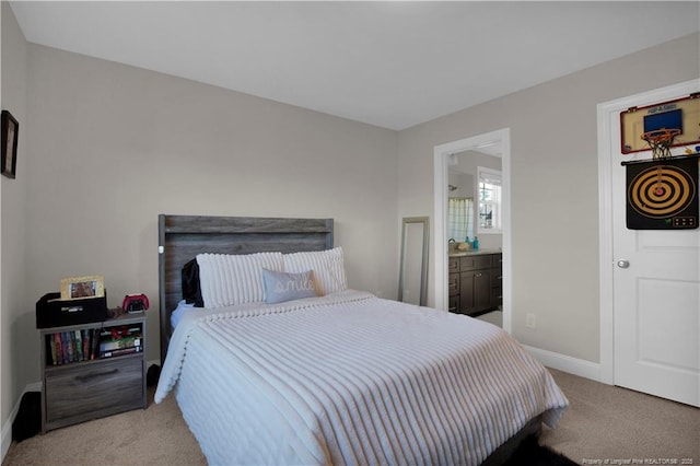 508 Rempstone Ln, Fayetteville, NC 28311 - bedroom with baseboards, ensuite bath, and carpet flooring