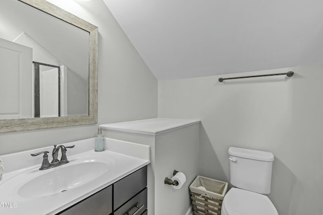 2801 Landon Ridge Dr, New Hill, NC 27562 - bathroom with an enclosed shower, toilet, vanity, and lofted ceiling