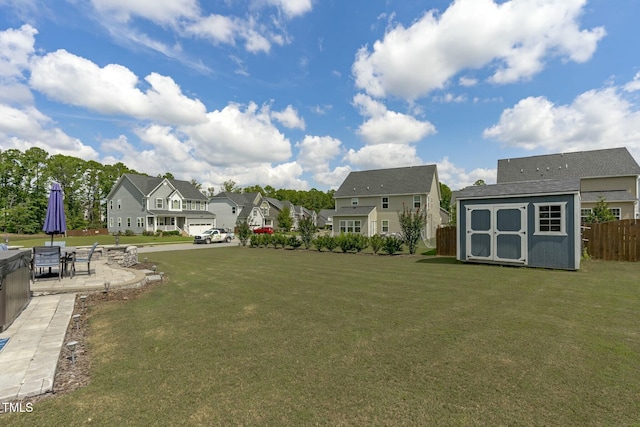 2801 Landon Ridge Dr, New Hill, NC 27562 - view of yard featuring a storage unit, an outbuilding, a patio, fence, and a residential view