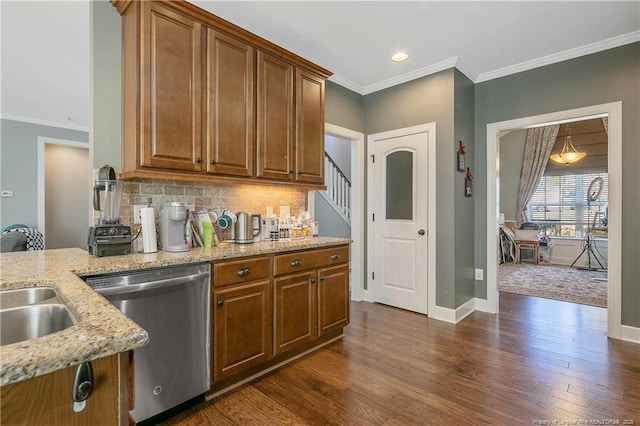 kitchen featuring stainless steel dishwasher, light stone counters, brown cabinetry, dark wood-style floors, and crown molding