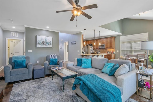 living room with ceiling fan, wood finished floors, recessed lighting, baseboards, and ornamental molding