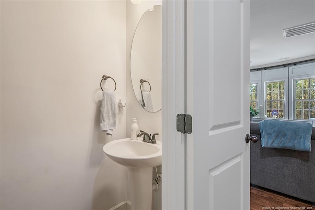 bathroom featuring wood finished floors