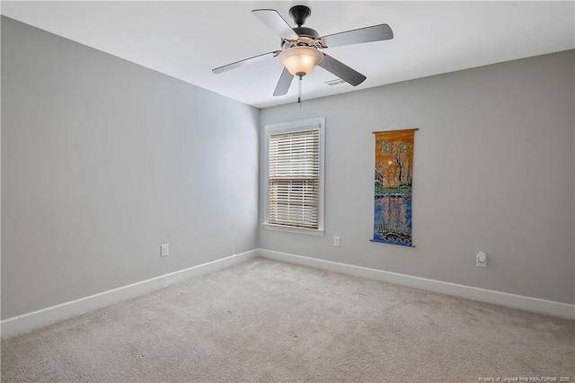 unfurnished room with baseboards, light carpet, and ceiling fan
