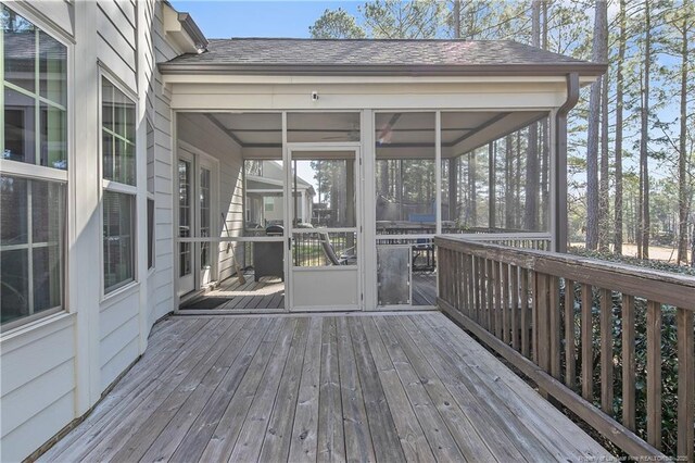 wooden terrace featuring a sunroom