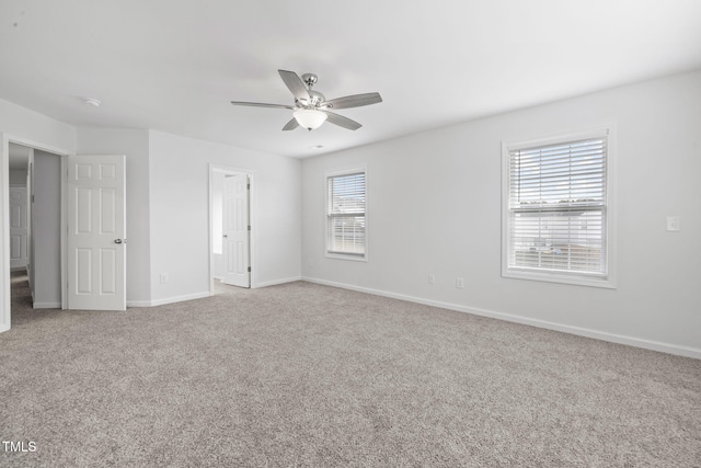 unfurnished bedroom with baseboards, carpet flooring, and a ceiling fan