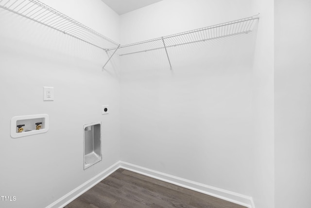 washroom featuring washer hookup, dark wood finished floors, hookup for an electric dryer, laundry area, and baseboards