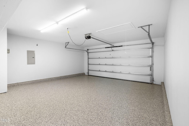 garage with electric panel and a garage door opener