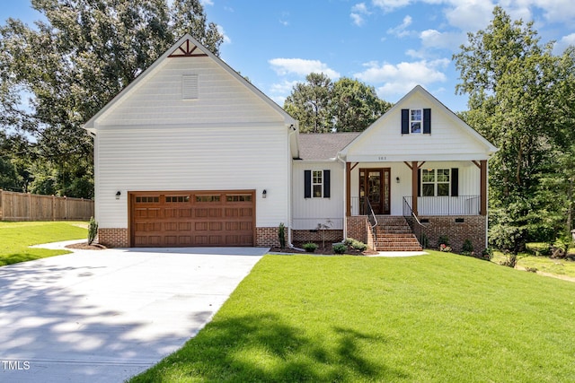 503 Forest Rd, Oxford, NC 27565 - view of front of home with driveway, an attached garage, covered porch, and roof with shingles