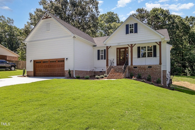 503 Forest Rd, Oxford, NC 27565 - view of front facade featuring concrete driveway, a front lawn, a garage, and covered porch