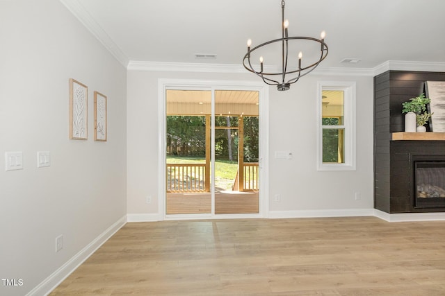 503 Forest Rd, Oxford, NC 27565 - unfurnished dining area featuring a chandelier, ornamental molding, healthy amount of natural light, and light wood finished floors