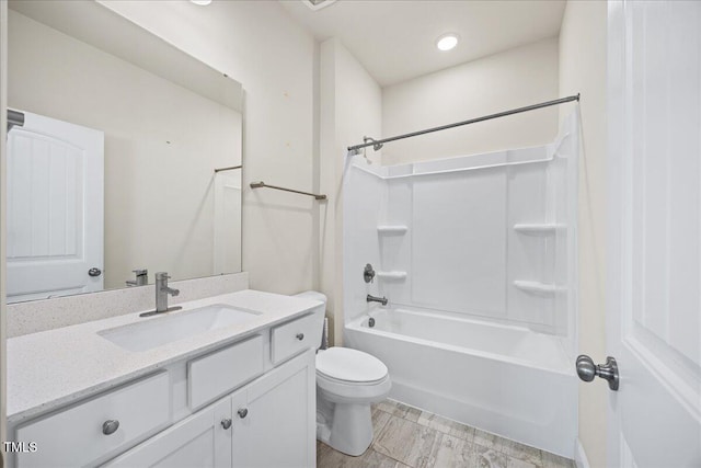 bathroom with recessed lighting, toilet, vanity, and bathing tub / shower combination