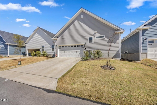view of front of house with a front yard and concrete driveway