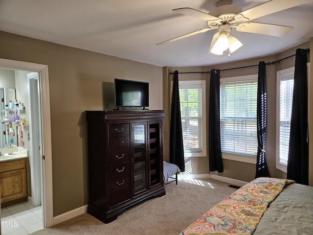 4116 Tall Pine Dr, Franklinton, NC 27525 - bedroom featuring baseboards, light colored carpet, connected bathroom, and a ceiling fan