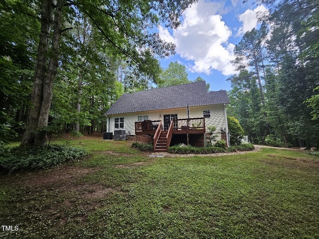 4116 Tall Pine Dr, Franklinton, NC 27525 - back of property with a deck, a yard, stairs, and central AC