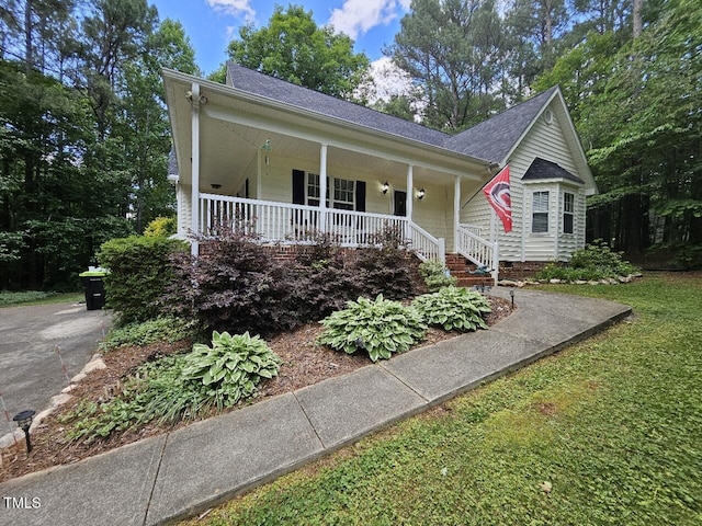 4116 Tall Pine Dr, Franklinton, NC 27525 - view of front of house with covered porch and a shingled roof