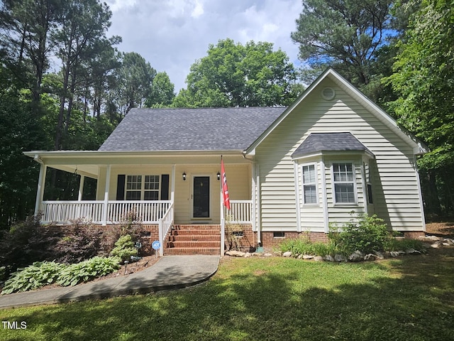 4116 Tall Pine Dr, Franklinton, NC 27525 - view of front of property with covered porch, a shingled roof, a front lawn, and crawl space